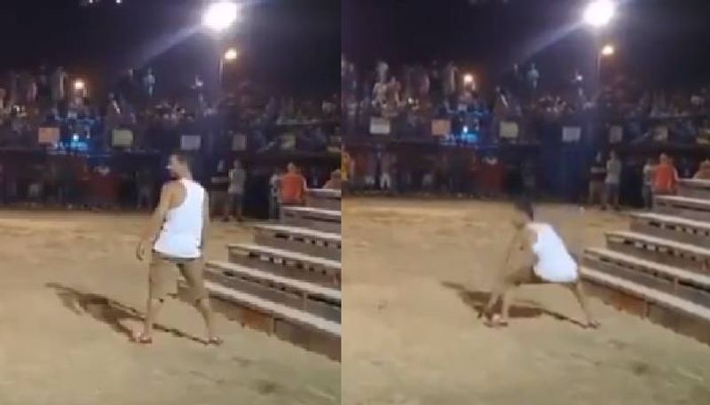 bull flips man in fire bull festival 