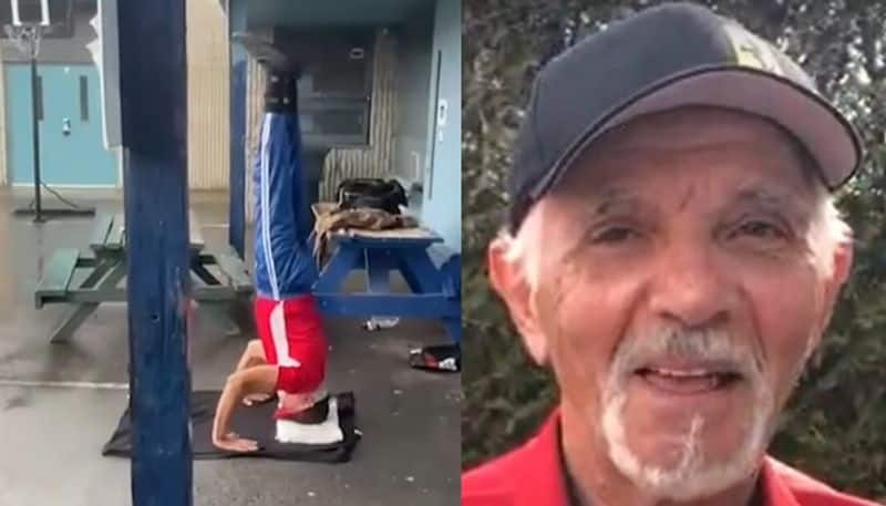 75 year old man gets guinness world record for doing headstand