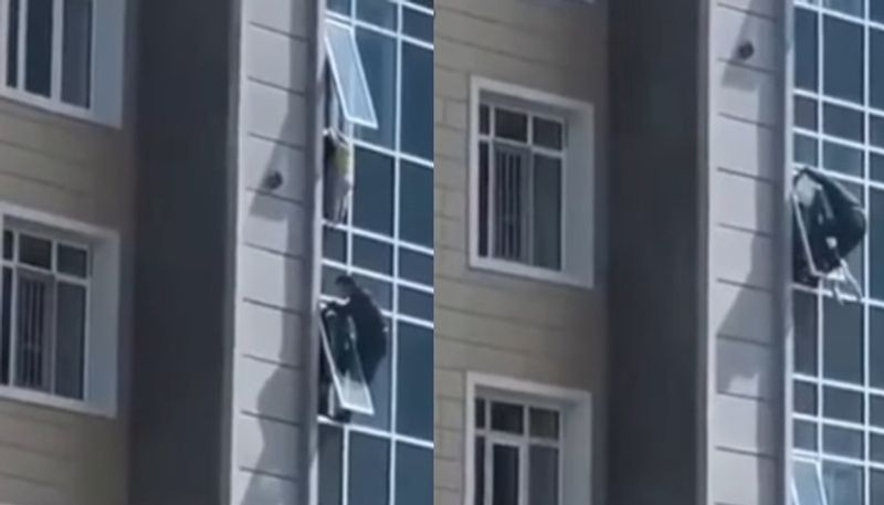 man rescues child from 8th floor window