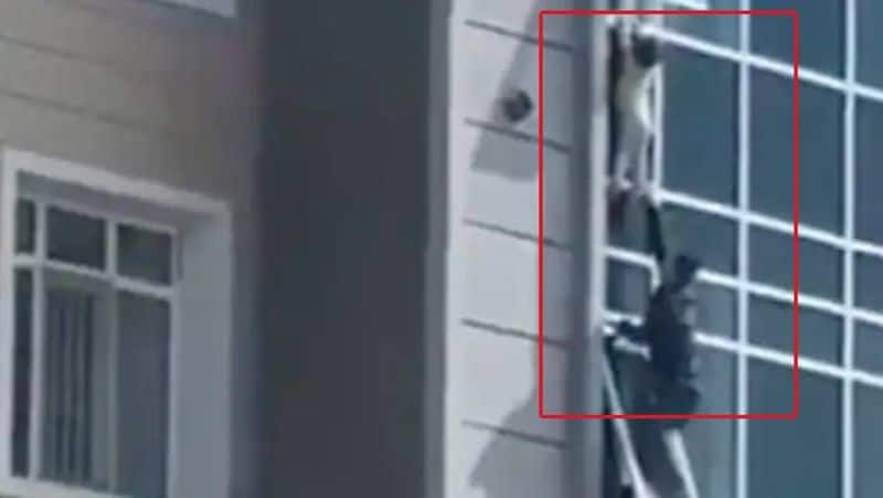 Caught On Camera Man Risks Life To Save Toddler Hanging From Eighth Floor Window