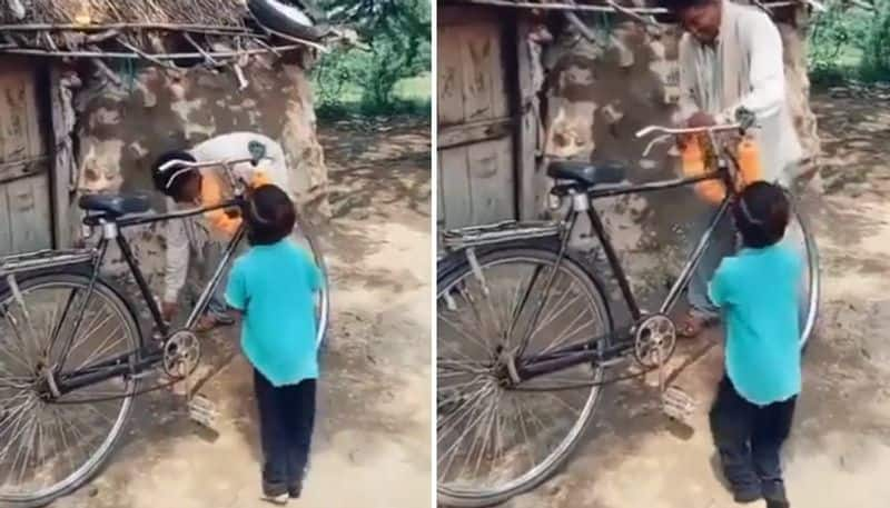 father bought second hand bicycle and son jumps with happiness