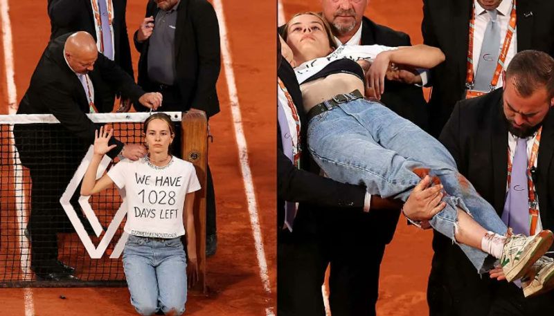 A protester, Who is Environmental Activist  Ties herself to the net to interrupt French Open semis Game 