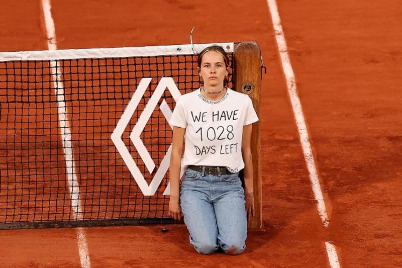 French Open Semi-Final Interrupted As Protester Ties Herself To Net