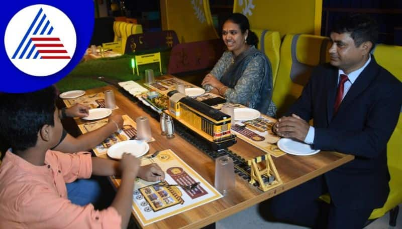 Food comes at your table through trains in Bannerghatta Platform - 65 Hotel gow 