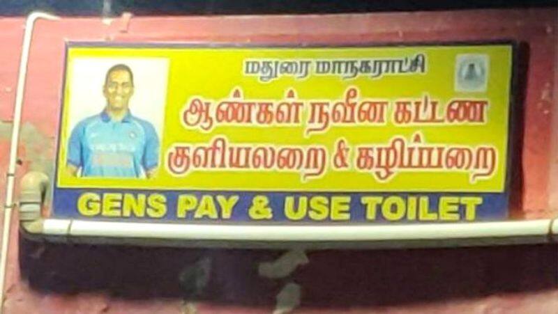 The photo of cricketer Dhoni in the Madurai Corporation men's toilet has caused controversy