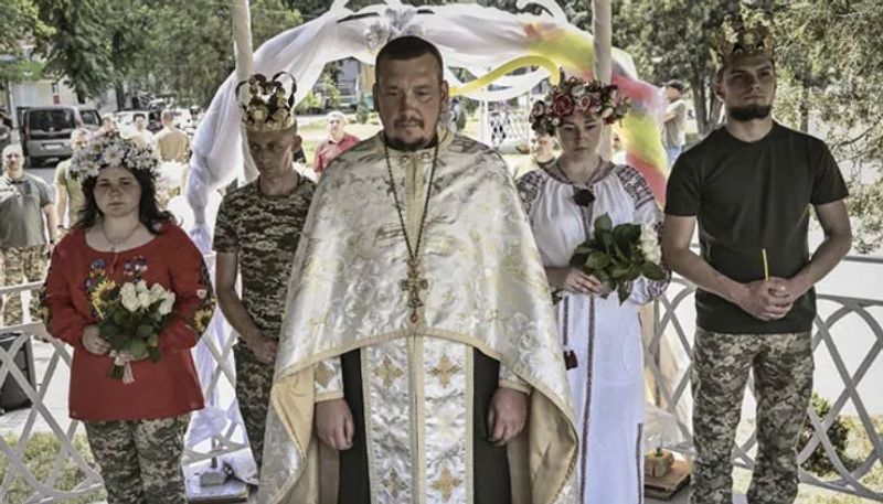 brides from ukraine wears soldiers uniforms on wedding 