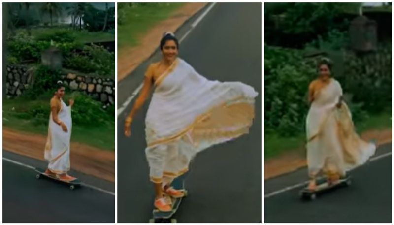 woman with sari and sliding on a skateboard in kerala