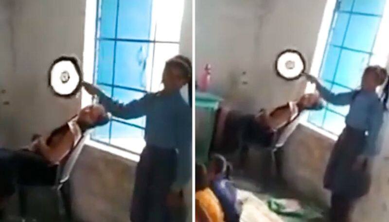 Watch Bihar student fans sleeping teacher in class; Netizens express anger-tgy