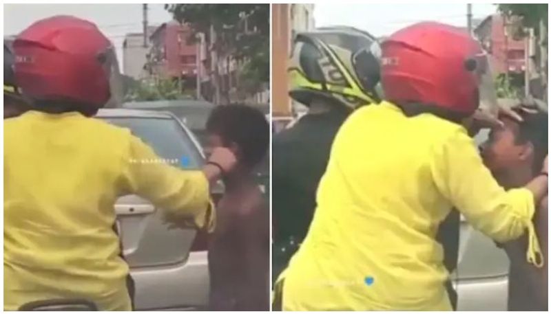 Viral video Woman pulls homeless boys cheek at traffic signal