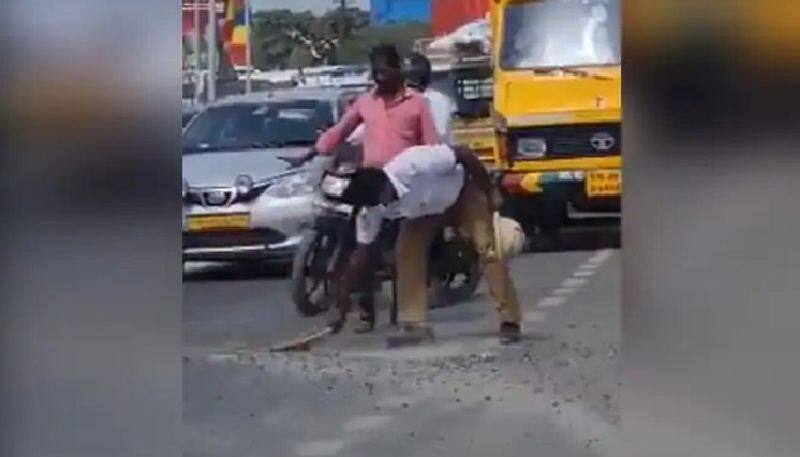 traffic policeman sweeps road to help commuters 