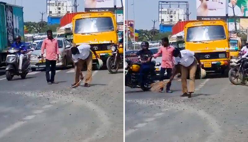 Watch Traffic cops sweep away trap rocks from road for commuters-tgy