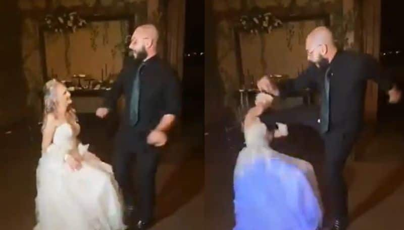 groom kicks brides face by mistake while dancing on wedding ceremony 