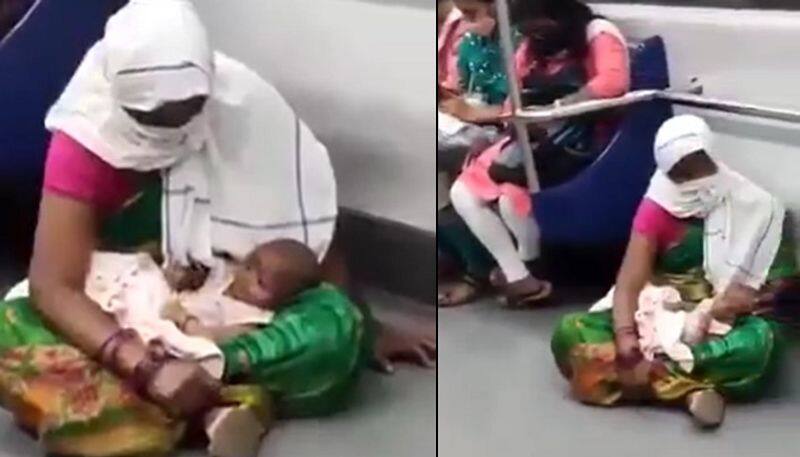 woman sitting in floor of metro with baby the video goes viral 