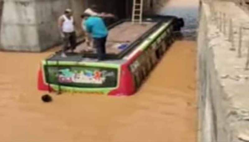 Police rescue Passengers from bus stranded in floodwater in Vikarabad District