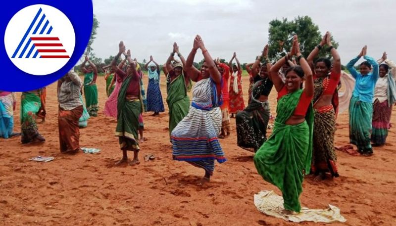 Narega workers who did yoga before start work at Huvina Hadagali in Vijayanagara