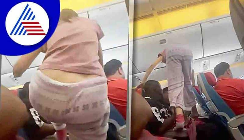 woman stepping over passengers to get to her window seat mid-flight has sparked a discussion online akb