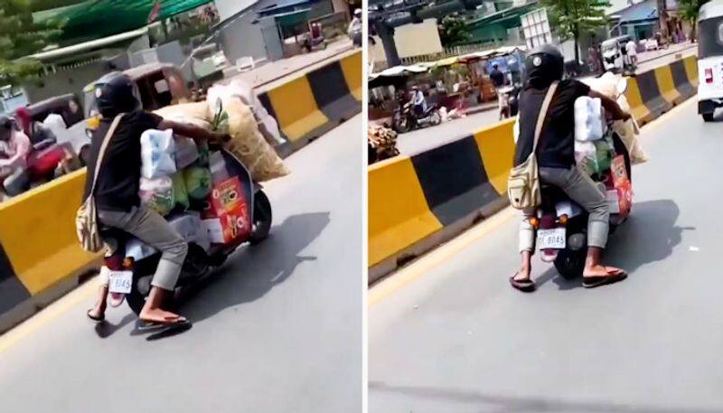 Watch Man rides an overloaded scooter in Telangana; cops issue an advisory-tgy