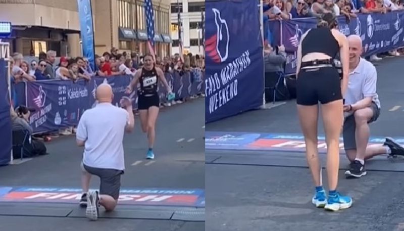 man proposes girlfriend while she finishes a marathon 