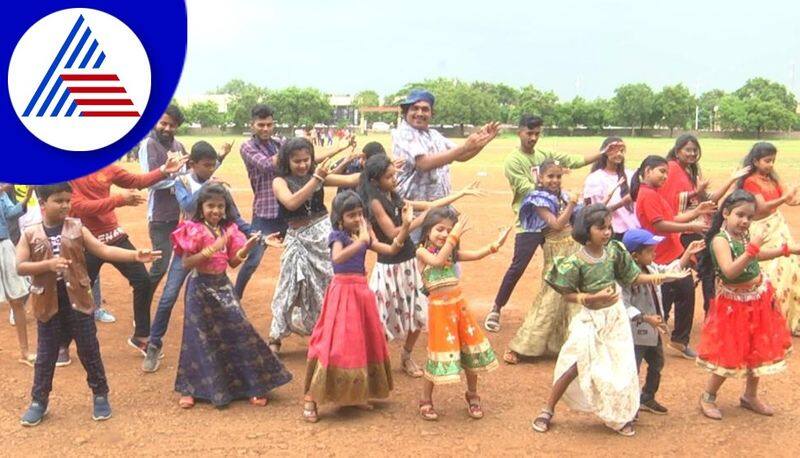 children and youths en masse dance to a ra ra rakkamma song during a soil conservation campaign at bagalkote gvd