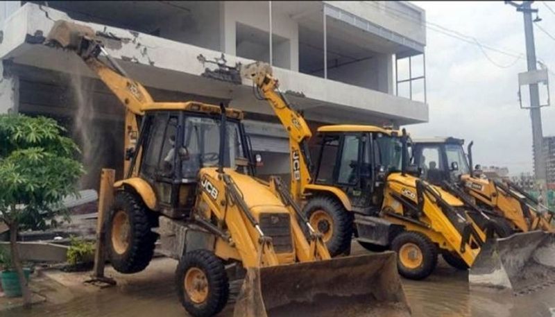 uttar pradesh sub divisional magistrate suspended for sending bulldozer to trader house ash