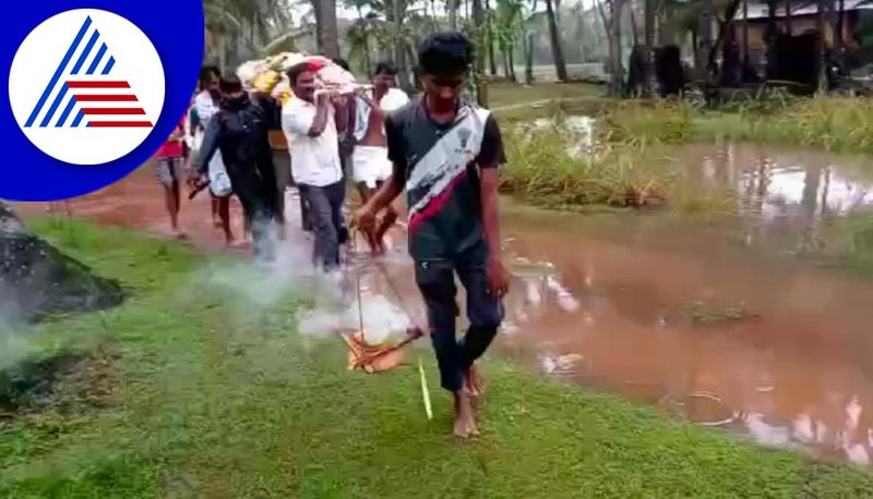 old woman corpse carried through flood water at katapadi in udupi district gvd