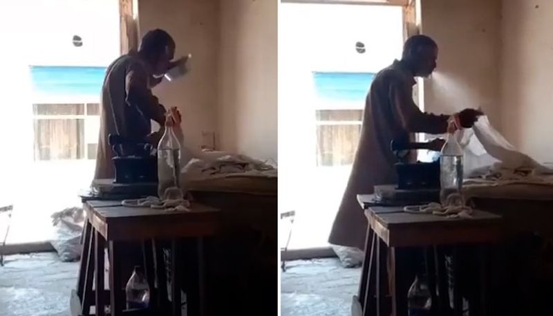 Viral video shows man spitting on clothes while ironing them gcw