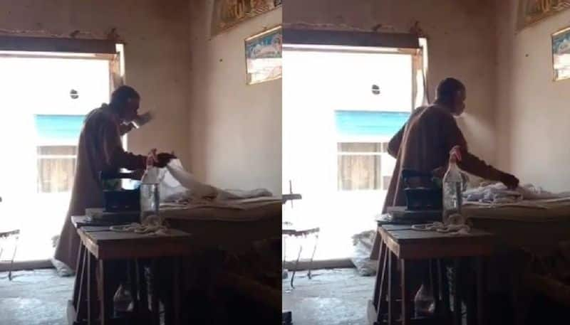 man spits water while ironing the video goes viral 