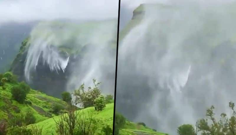 Mesmerizing view of an evaporating mystical waterfall - gps