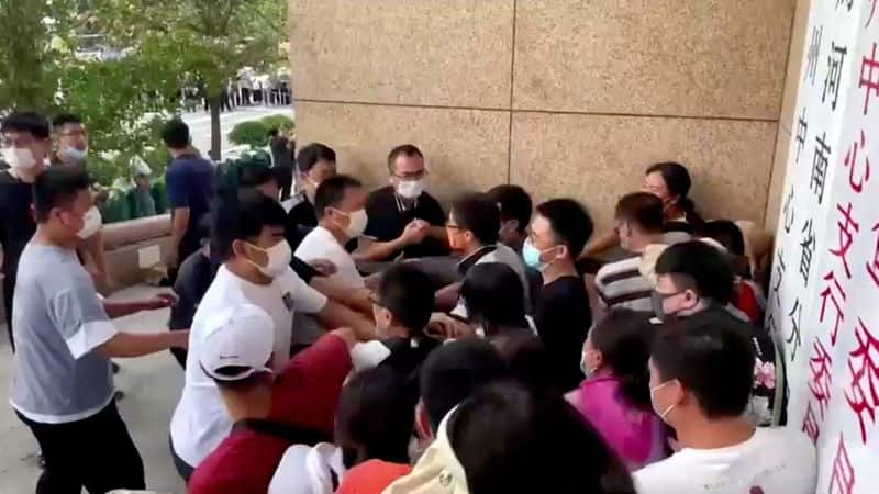 protest economic crisis and frozen millions of dollars worth of deposits in china