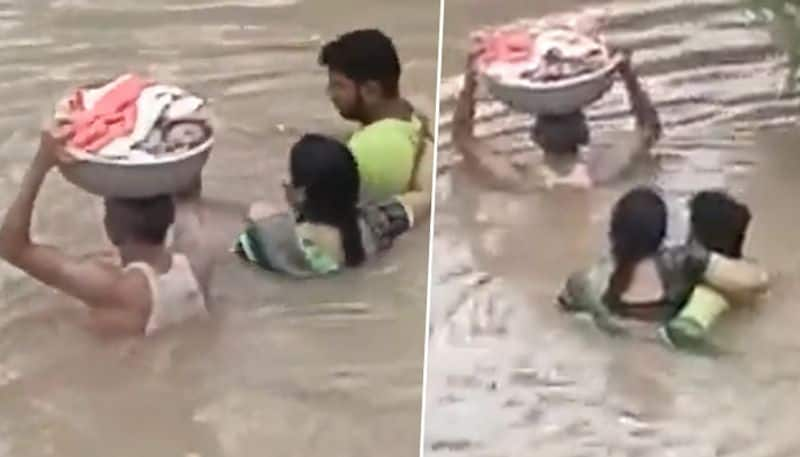 Watch: Man carries infant on head in a tub: reminds of Baahubali's iconic scene - gps