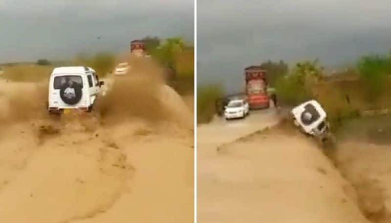 Watch Car plunges into ditch after driver speeds on flooded road-tgy