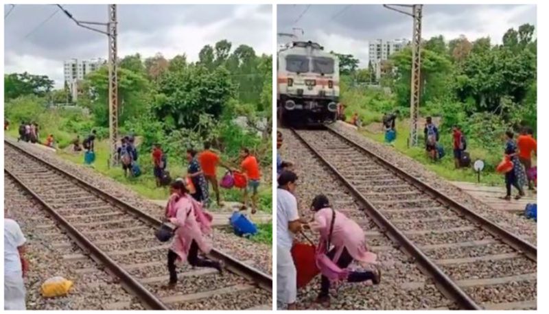 woman crosses railway tracks just seconds before a train arrives viral video 