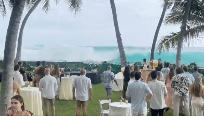 giant wave intrudes in to wedding party in hawaii island