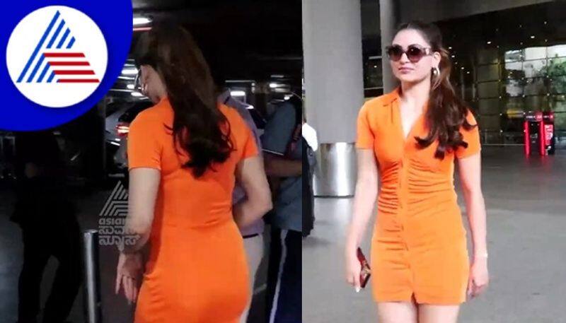 Urvashi Rautela snapped at airport wearing orange maxi vcs 