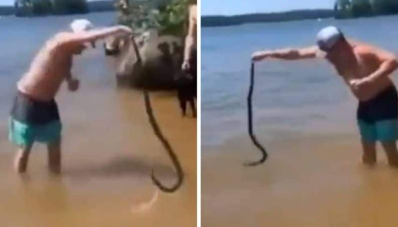 man thrown snake on people 