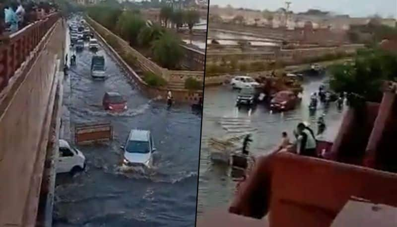 Heavy rain forces cars to drive through flooded streets in Lucknow; Watch - gps