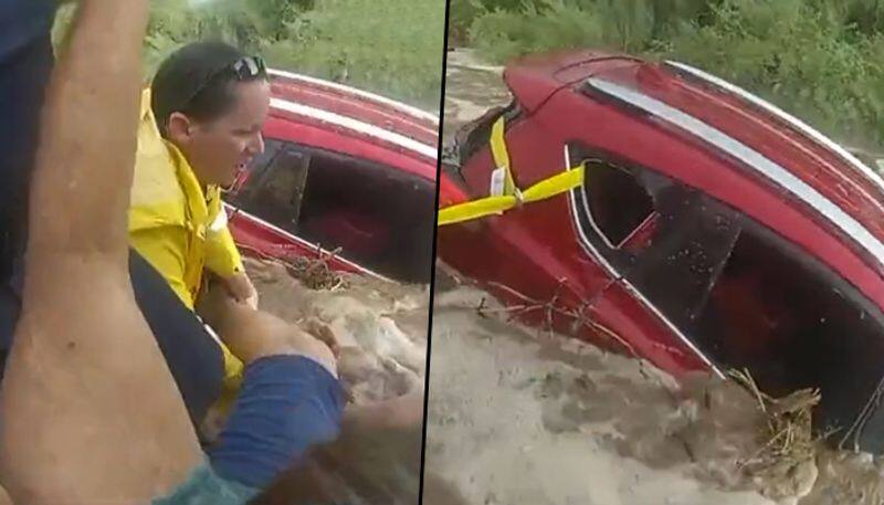 Cops save woman trapped in car amid rising flood waters: watch video - gps