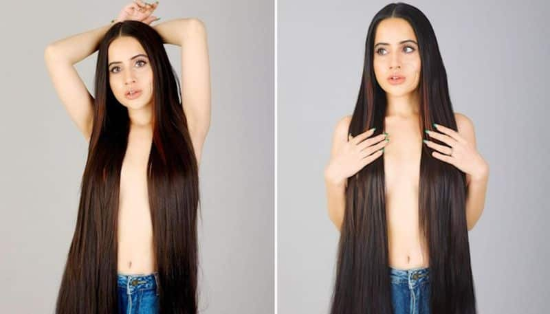 Uorfi Javed poses topless for pictures covers assets with long hair drb