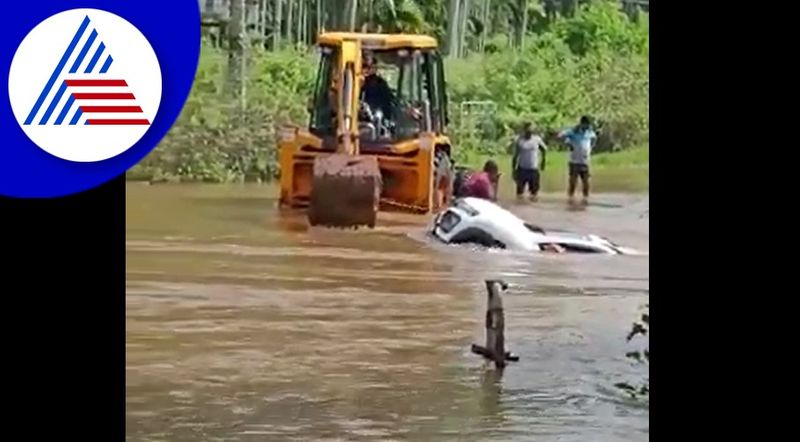 car washed away in flooded water at chikkamagaluru, 2 resuced akb