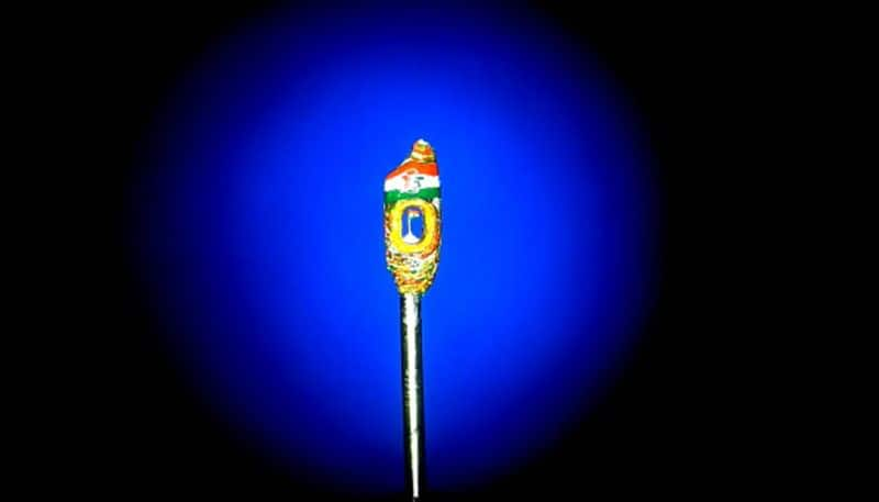 national flag designed on golden grain of rice in jagtial 