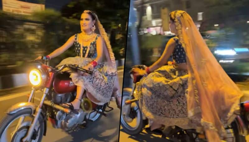 Woman dressed as bride rides bullet to the wedding venue; viral video - gps