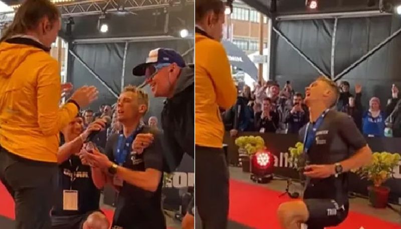 man proposes girl amid leg cramp after triathlon