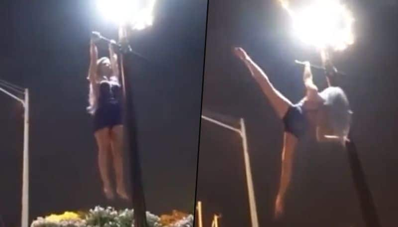 Woman executes aerobics on a lamp post; viral video shocked netizens - gps