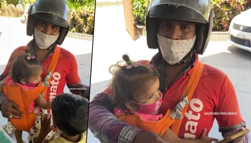 Heartwarming video of food delivery guy carrying kids to work is winning hearts online - gps