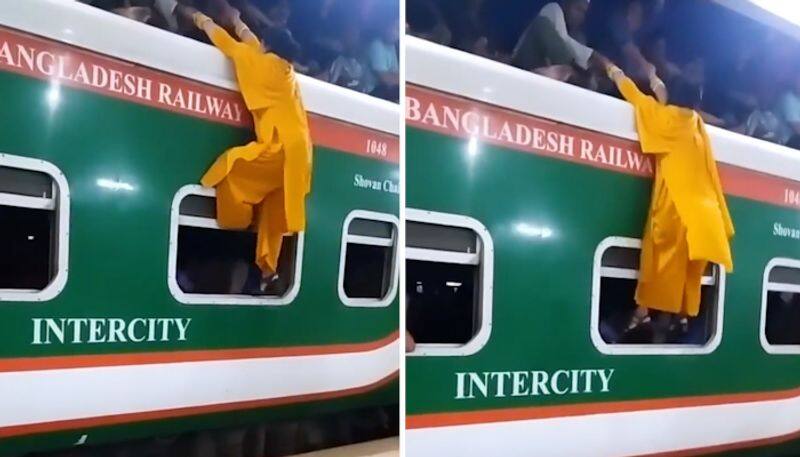 Woman Trying To Climb Train Roof in bangladesh goes viral in internet