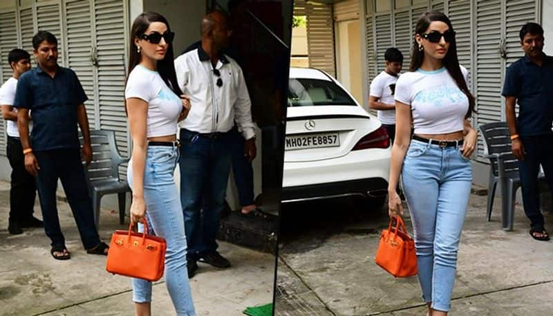 WATCH Nora Fatehi donned white crop top with blue denims; netizens trolled her for her walk RBA