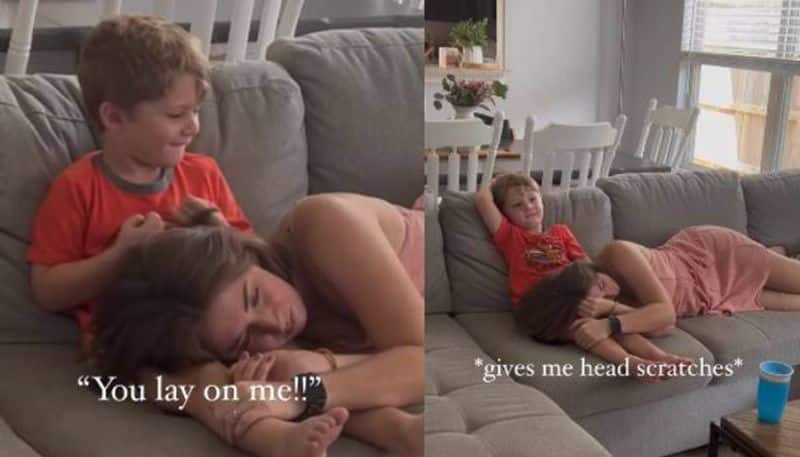 mom rests her head on child s lap in viral video 