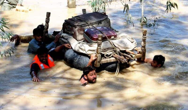 Flooding in Pakistan kills over 1,000 people in a "serious climate disaster"