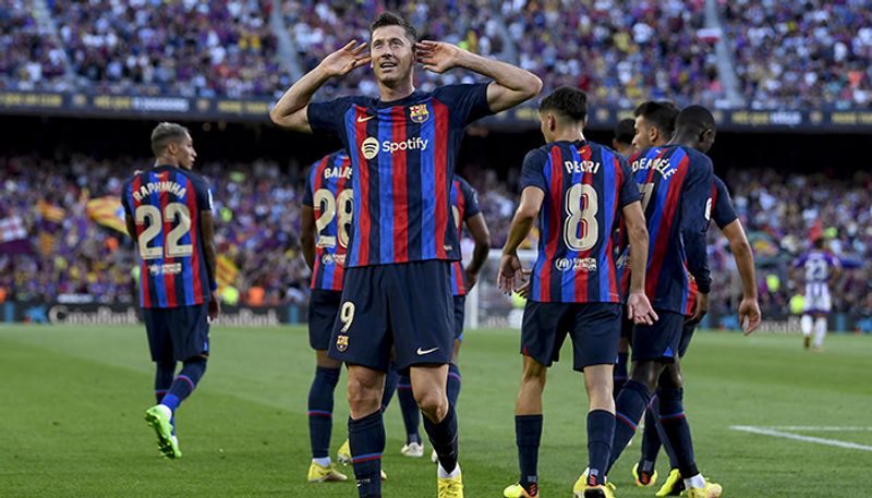 football Robert Lewandowski nets double as Barcelona begin Hansi Flick reign with 2-1 La Liga win over Valencia scr