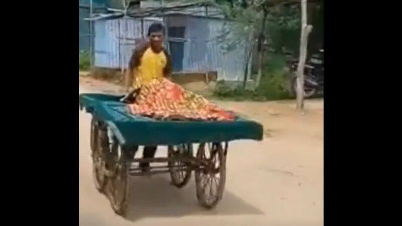 Ambulance is not found husband taking his pregnant wife in a hand cart